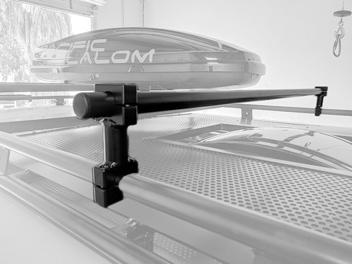 Close-up picture highlighting Aluminess Universal Roof Rack Crossbar on a van's roof rack.