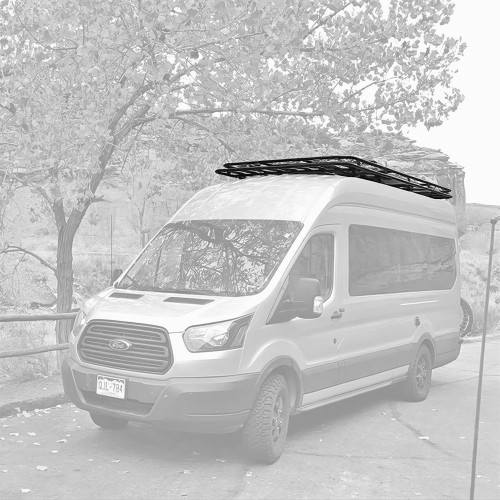 Close-up picture of Aluminess Weekender Roof Rack on a white Ford Transit van.