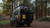 Rear door view of an white Mercedes Sprinter van featuring Aluminess Rear Door Rack Base Unit carrying a box, a bike and overlanding products.