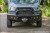 Transit van with Front Winch Bumper 2020+ with bull bar and brush guards, parked on grass.