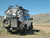 White Ford E-Series van with an off-road rear bumper and swing arm system from Aluminess Products.