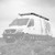 Black and white image highlighting Aluminess Weekender Roof Rack for Sprinter vans.