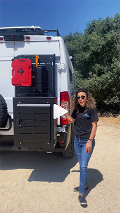 Woman Next to Outfitted Overland Van