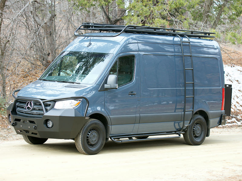 Blue Mercedes Sprinter van outfitted with several off-road accessories by Aluminess Products.