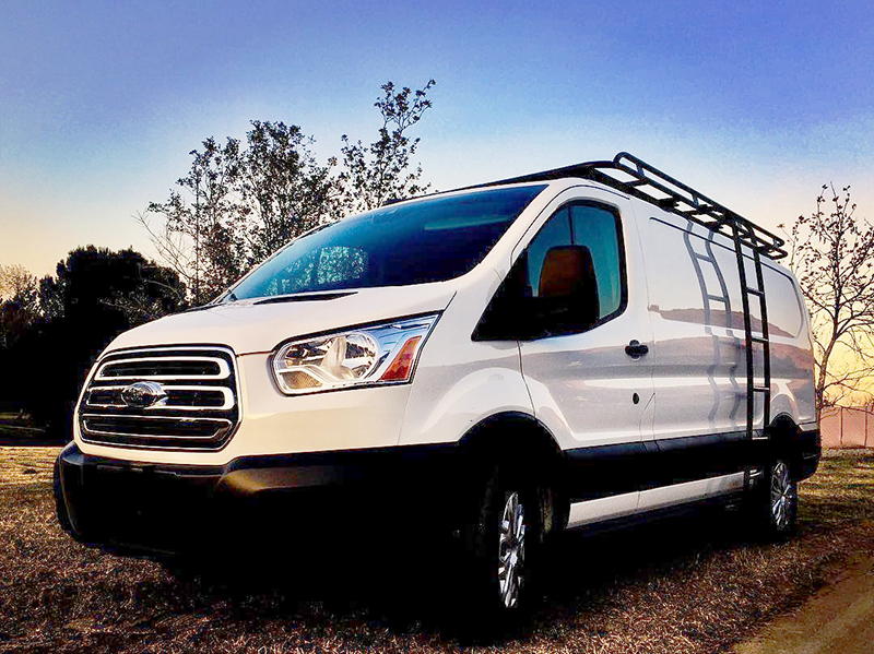 Side view of a black Ford Transit van featuring Aluminess Weekender Roof Rack.