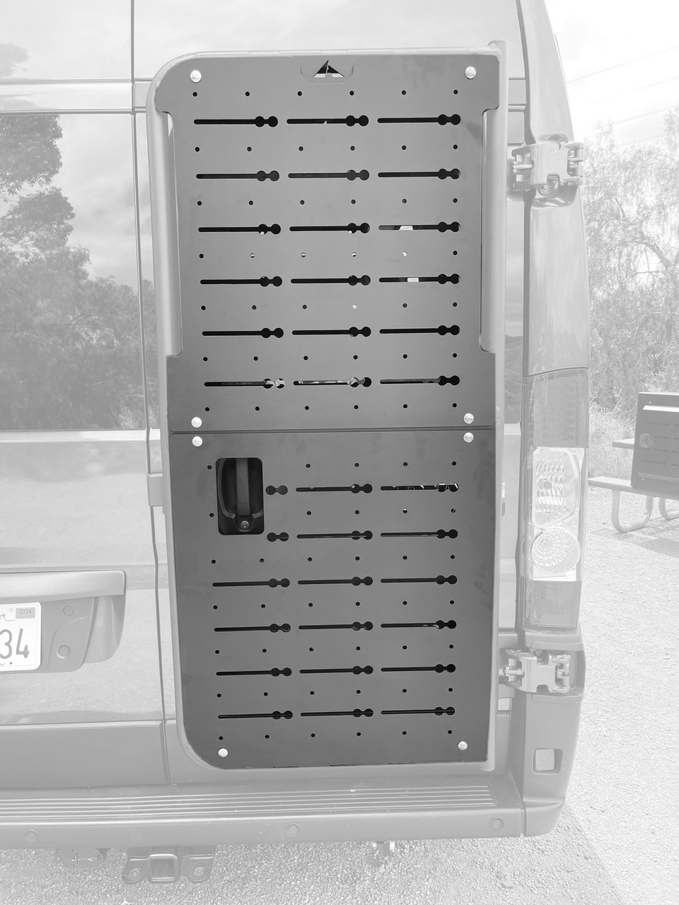 Dodge RAM Promaster with an Aluminess rear door Base Unit Mount and BackPACK Mounting Plate.