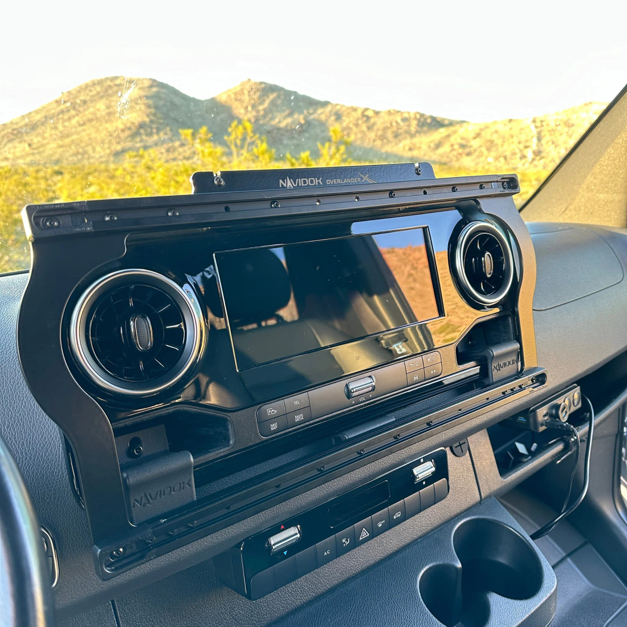 Terra X Sprinter Dash Mount System installed in a Sprinter 2019+, shown in a vehicle interior with mountains in the background.