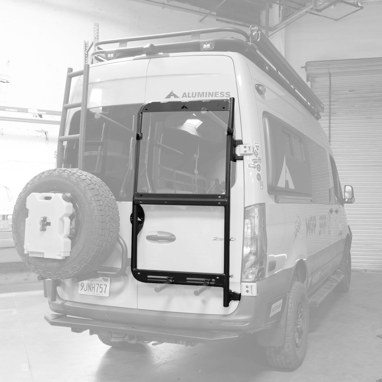 Rear door view of an white Mercedes Sprinter van highlighting Aluminess Rear Door Rack Base Unit.