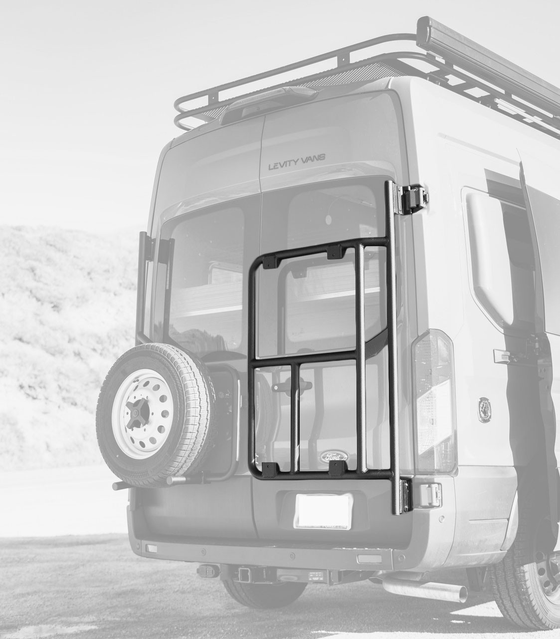 Rear door view of a Ford Transit van highlighting Aluminess Rear Door Rack Base Unit.