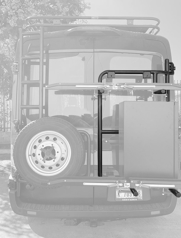 Rear view of a Ford Transit van highlighting Aluminess Rear Door Rack parked on the street.