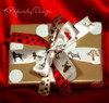 Our ribbon mix of Paw Prints and Dogs on Parade work so well together to make the perfect pet present!