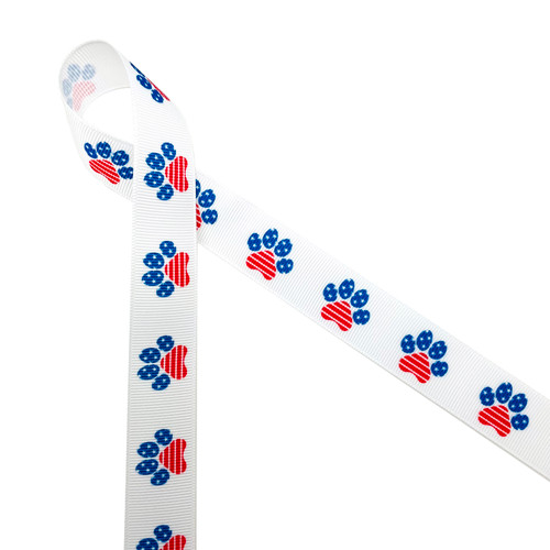 Patriotic paw prints in red, white and blue and stars and stripes printed on 7/8" white grosgrain is a fun ribbon for celebrating the 4th of July with your furry friends. This is a fun ribbon for hair bows, head bands, gift wrap, gift baskets, party decor, table decor and party favors. Be sure to have this ribbon on hand for pet themed crafts, sewing and quilting projects too! All our ribbon is designed and printed in the USA