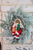 Primitive Nicholas Doll Holding Tree