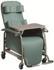 Preferred Care Recliner shown with optional head support, body bolster, activity tray table and adjustable footrests