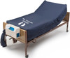 MicroAir MA900 lateral rotation low air loss mattress and blower control unit on bed