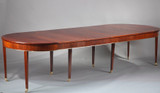 TABLE OVALE DE STYLE DIRECTOIRE A ALLONGES EN PLACAGE D'ACAJOU TABLE OVALE DE STYLE DIRECTOIRE A ALLONGES EN PLACAGE D'ACAJOU