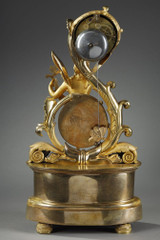 clock with winged genie design