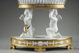 Basket resting on two cupids
