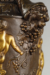 Pair of covered vases, in finely chased bronze with a rich rotating decoration