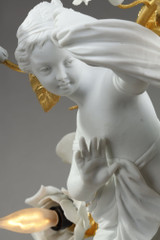 Pair of Eros and draped Venus candelabra porcelain biscuits