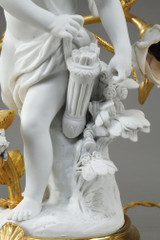 Pair of candelabra with porcelain sculpture