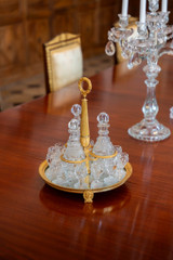 CHARLES X PERIOD LIQUEUR SERVICE IN GILT BRONZE AND CUT CRYSTAL