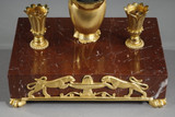 Inkish in gilded bronze and red cherry marble, Empire period, early 19th century