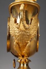 Empire period clock with a putto in a chariot