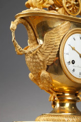 Empire period clock with a putto in a chariot