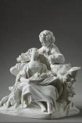 Due figure sedute in un gruppo scultoreo in porcellana biscuit