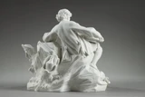 Scultura a forma di biscotto poggiata su una base rettangolare