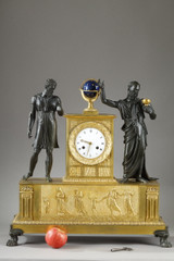 Empire style clock adorned with two mythological figures