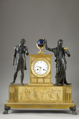 Antique clock decorated with figures inspired by Greek mythology