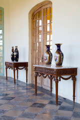 PAIR OF LOUIS XVI STYLE CONSOLE TABLES IN WALNUT AND MARBLE