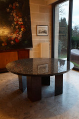 Round modernist table in granite