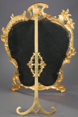 Miroir doré ancien de style Rocaille Miroir doré ancien de style Rocaille