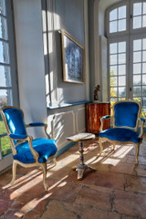 FOUR LOUIS XV PERIOD TUCK-NECK VELVET ARMCHAIRS