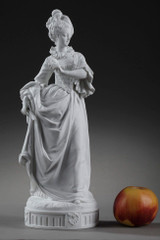Biscuit figurine of a woman at a ball