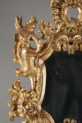 18TH CENTURY ITALIAN MIRROR IN CARVED AND GILDED WOOD.
