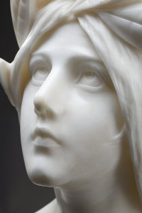 Bust of a young woman in marble