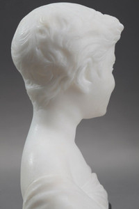 Small alabaster sculpture of a boy