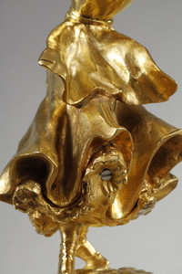 Gilded bronze lamp sculpture of a woman carried away with her umbrella