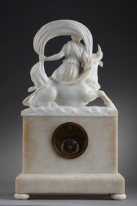 Clock with engraved dolphins in low relief