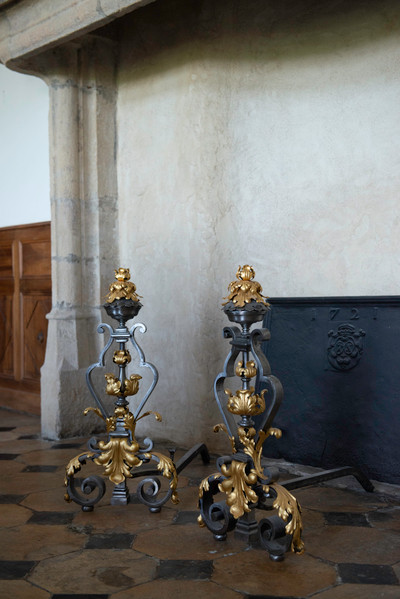 VERY LARGE PAIR OF WROUGHT IRON FIREPLACE FRONTS WITH FOLIAGE DECORATION, MASK AND SCROLLS