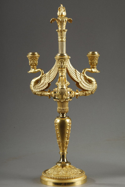 arms shaped like swans with outstretched wings