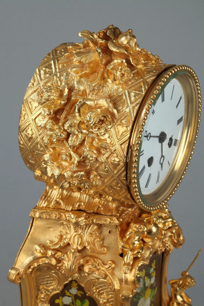 Reloj rococó en bronce dorado