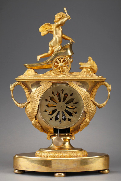 Empire period clock with a putto in a chariot
