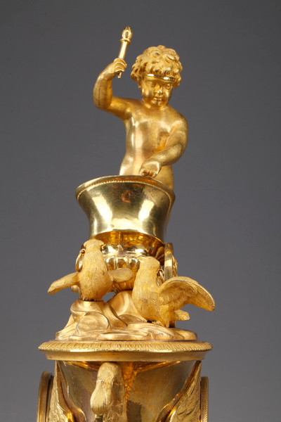 Empire period clock with a putto in a chariot