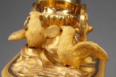 Empire period clock with a putto in a chariot