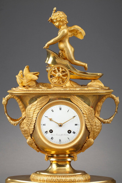 Empire period clock with a putto in a chariot